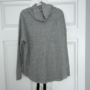 Grey turtle neck sweater.